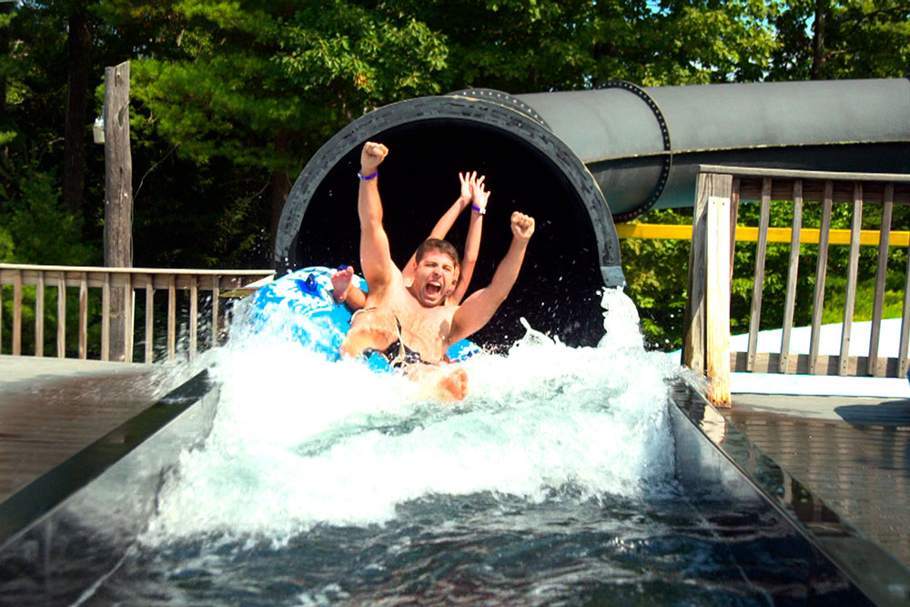 Guests Emerge From Black Vortex Slide Guests Emerge From Black Vortex Slide